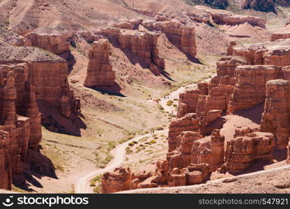 Charyn Canyon top view - geological formation consists of amazing big red sand stone. Charyn National Park. Kazakhstan. Charyn Canyon top view - geological formation consists of amazing big red sand stone. Charyn National Park. Kazakhstan.