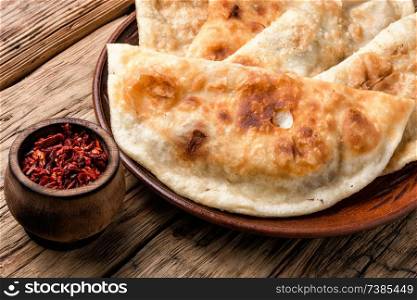 Cheburek, unleavened patty stuffed with minced meat.Cheburek, the national dish of the Crimean Tatars. Cheburek,dough pie with meat filling