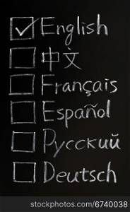 Check boxes of different languages written on a blackboard