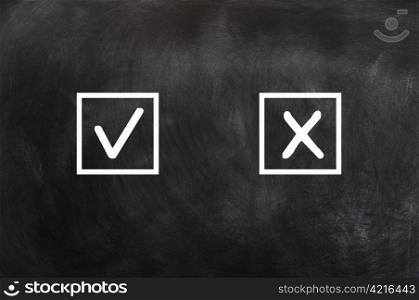 Check boxes with tick and cross on a blackboard