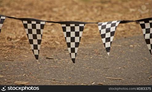 Checkered Flag F1 Grounds. Racing flags in a race and fast cars
