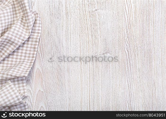 checkered tablecloth on wooden table top view