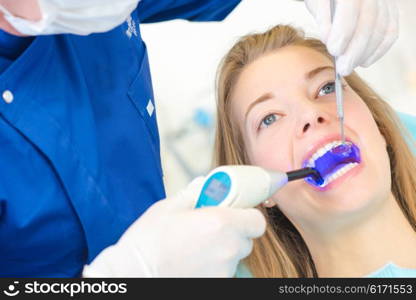 Checking inside woman&rsquo;s mouth