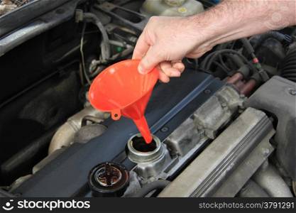 Checking the oil level of an older car