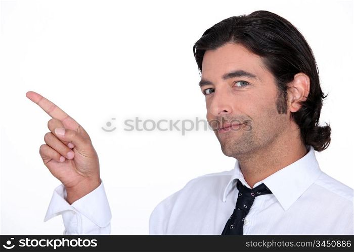 Cheeful businessman pointing