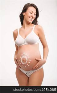 Cheerful and pregnant young mother - isolated