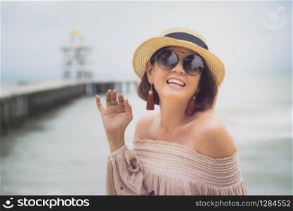 cheerful asian woman happiness emotion at sea beach