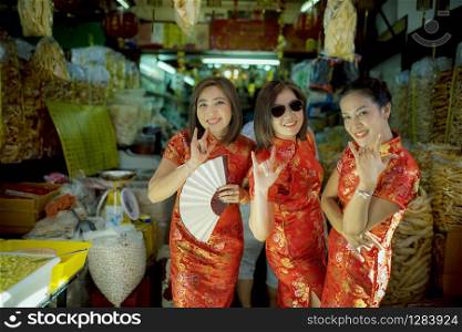 cheerful asian woman wearing chinese tradition clothes toothy smiling face in bangkok china town