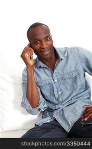 Cheerful black man talking on mobile phone
