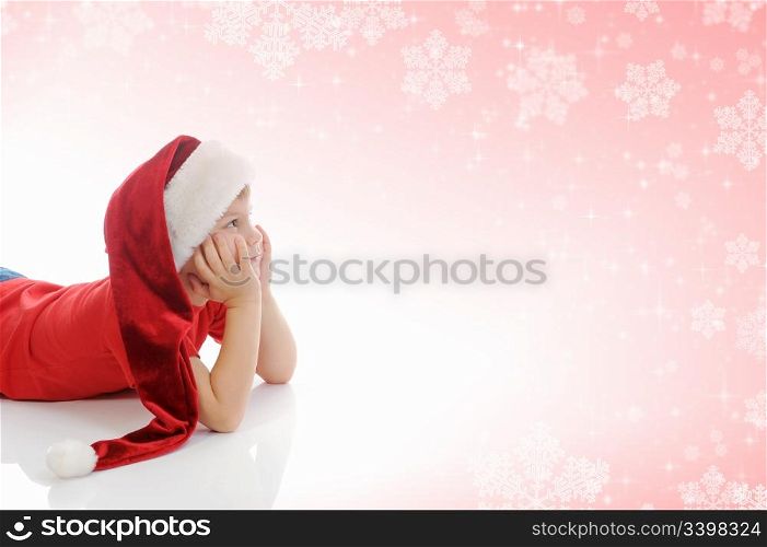 Cheerful boy in red Santa Claus hat