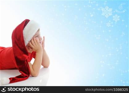 Cheerful boy in red Santa Claus hat