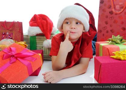 Cheerful boy in Santa Claus christmas hat. Isolated on white background