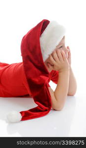 Cheerful boy in Santa Claus hat. Isolated on white background