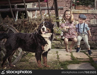 Cheerful brother and sister relaxing on an autumnal farm