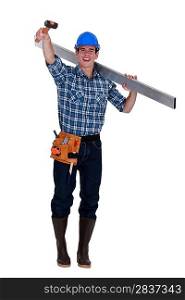 Cheerful builder holding rubber mallet in the air