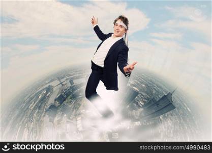 Cheerful businessman. Young funny businessman wearing tie around head