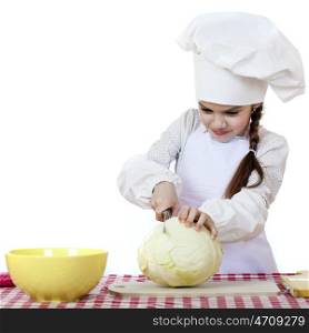 Cheerful caucasian little girl in cook hat holding a head of cabbage, isolated on white background