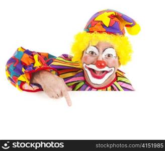 Cheerful clown pointing to blank white space. Isolated design element.