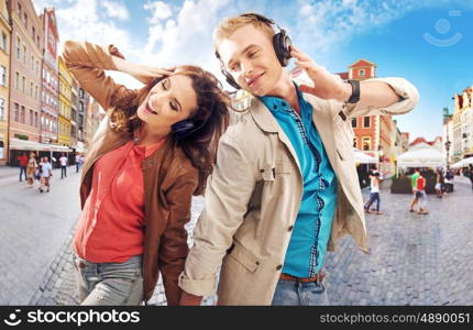 Cheerful couple dancing in the downtown