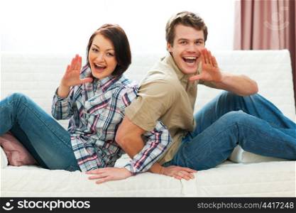 Cheerful couple having fun at home