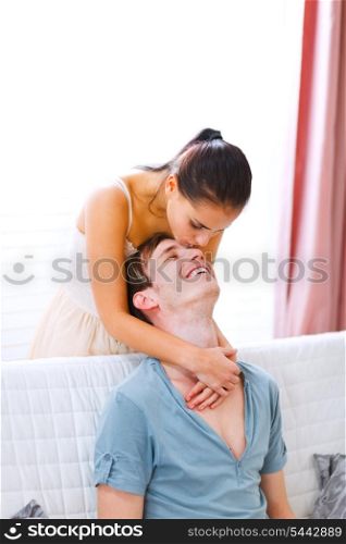 Cheerful couple in love enjoying themselves at home&#xA;