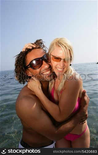 Cheerful couple in the sea