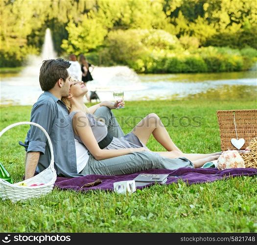 Cheerful couple resting in the park