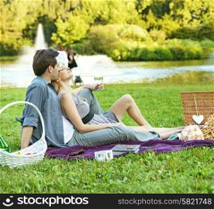 Cheerful couple resting in the park