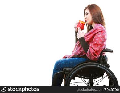 Cheerful crippled lady on wheelchair.. Disability drink relax leisure concept. Cheerful crippled lady on wheelchair. Smiling disabled girl holding red cup drinking beverage.