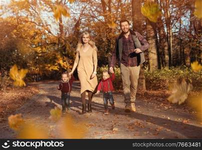 Cheerful family enjoying great, autumnal weather