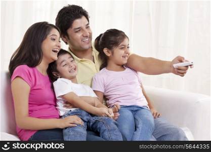 Cheerful family watching TV