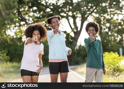 Cheerful friends African black children laugh merrily and point at the camera.brightness in adolescence.positive emotion