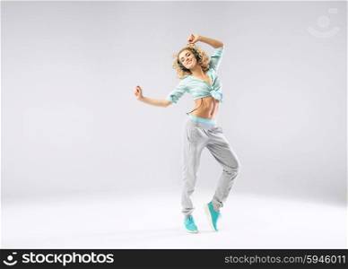 Cheerful girl exercising with relaxing music