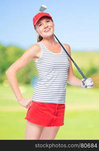 Cheerful girl with a golf club in a red cap and skirt on a background of golf courses