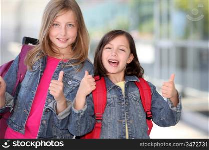 Cheerful grade-schoolers going back to school