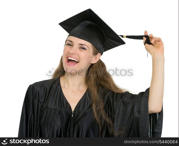 Cheerful graduation student girl playing with tassel