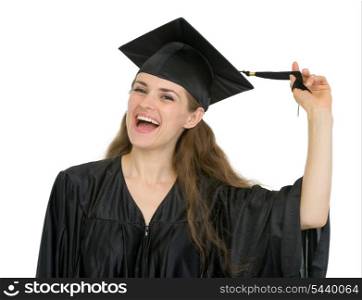 Cheerful graduation student girl playing with tassel