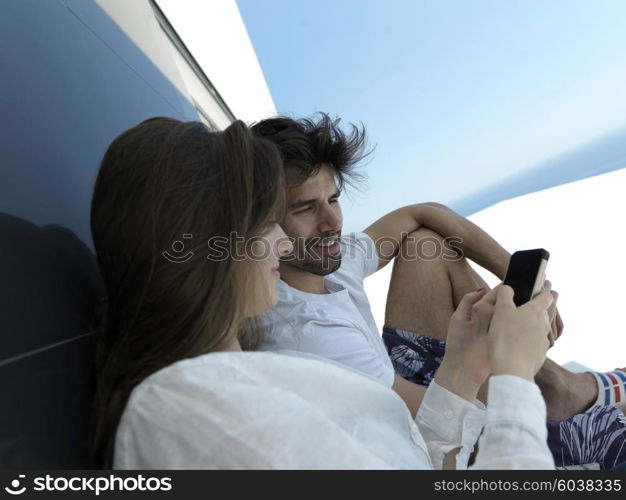 cheerful happy young couple making selfie together at home