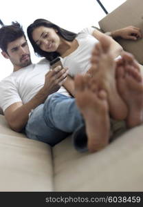 cheerful happy young couple making selfie together at home