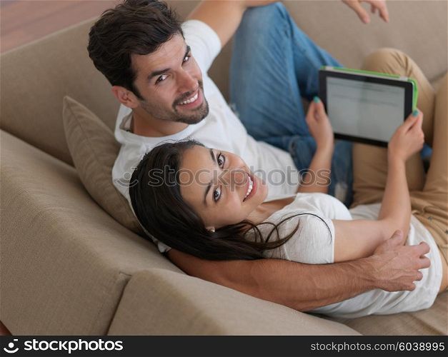 cheerful happy young couple making selfie together at home