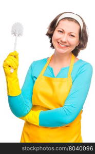 cheerful housewife in yellow apron holding a brush to clean the toilet isolated on white background