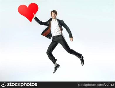 Cheerful jumping guy witha big heart