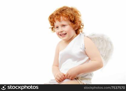 Cheerful little boy in an image of the cupid, isolated on a white background