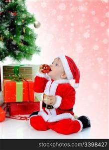 Cheerful little boy in Santa Claus hat.