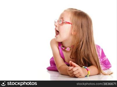 cheerful little girl glasses funny is lying isolated on the white background