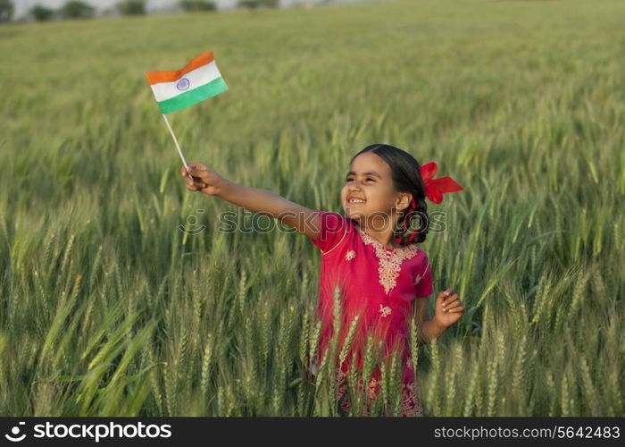 Cheerful little girl holding Indian flag