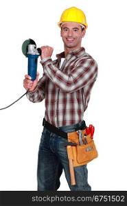 Cheerful manual worker holding angle grinder