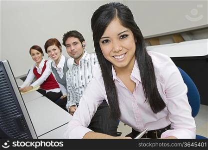 Cheerful Multi Racial Group of Business people Sitting at Desk