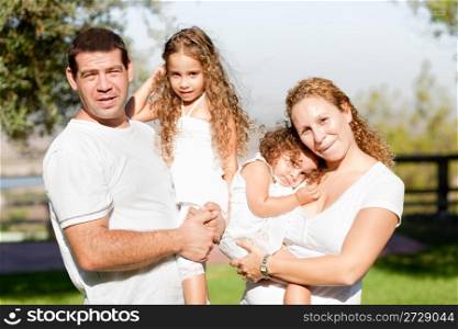 Cheerful parents with their children