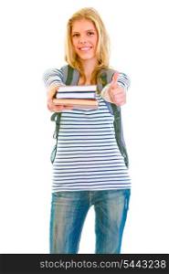 Cheerful pretty girl with backpack and books showing thumbs up isolated on white &#xA;